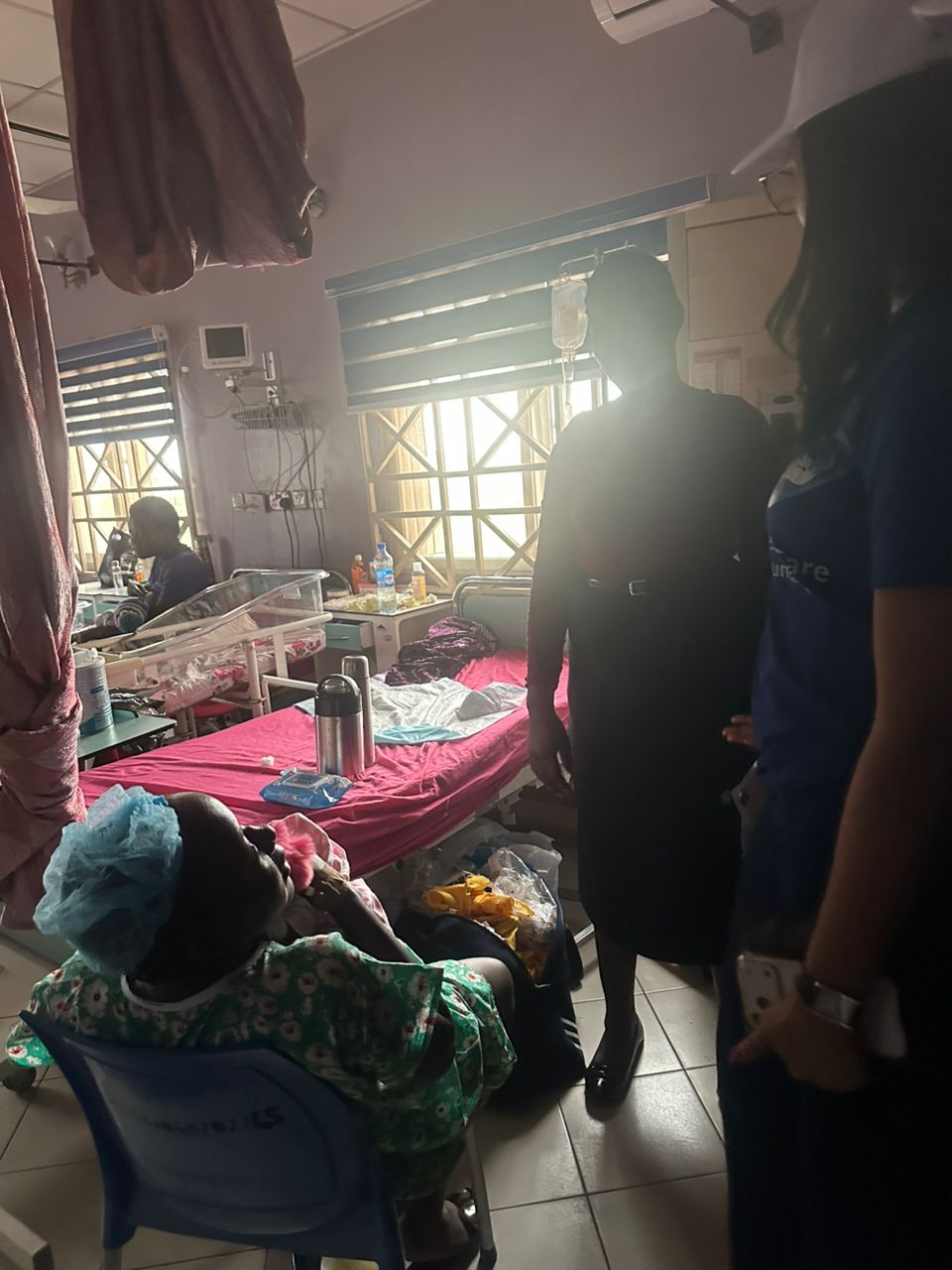 Smiling mother receiving healthcare support during outreach